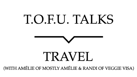 Image contains a white background with black text that says "T.O.F.U. Talks" above a black line with a small indent in the centre pointing below to text that says "Travel (With Amélie of Mostly Amélie and Randi of Veggie Visa)".