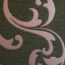 Photo contains light pink swirls on a dark grey background.